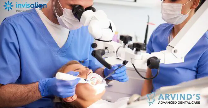 Dentist performing a detailed dental procedure using a dental microscope