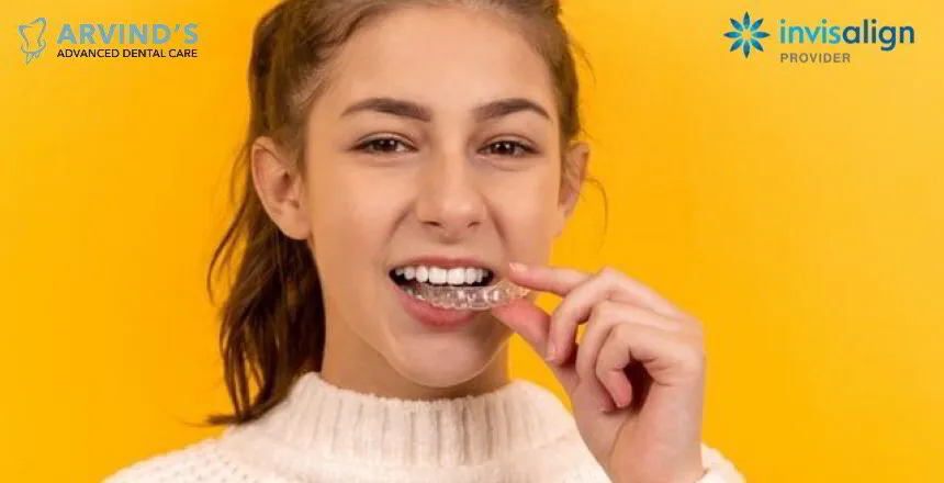 Woman wearing a clear Invisalign aligner for discreet teeth straightening