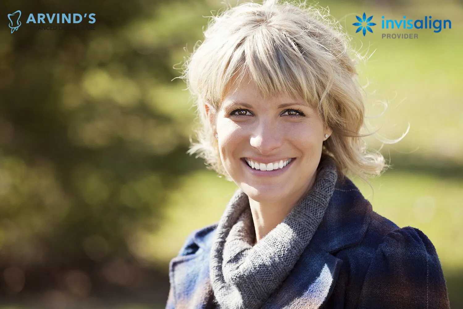 Smiling woman wearing a scarf, showcasing a bright and confident smile